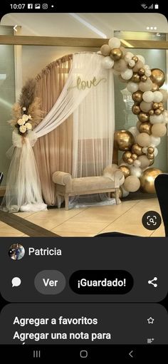 a room decorated with gold and white balloons for a baby shower or birthday party in spanish