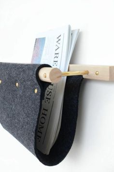 a magazine holder made out of felt and wood