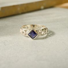 I O L I T E ∙ R I N G This ring features a captivating square-cut Iolite gemstone that serves as the centrepiece. The band is beautifully adorned with intricate filigree designs, adding a touch of craftsmanship to the classic silver setting. Combines the deep, regal hues of the Iolite with the elaborate detailing of the band, creating a piece that is both sophisticated and enchanting. This ring is also available in Citrine, Garnet, Amethyst, Peridot, and Blue Topaz  Gemstone. Please write to us Handcrafted Silver Jewelry, Natural Stone Jewelry, Filigree Design, Unique Handmade Jewelry, Topaz Gemstone, Elegant Jewelry, Solid 925 Sterling Silver, Stone Jewelry, Blue Topaz