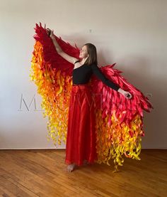 a woman wearing a red and yellow dress