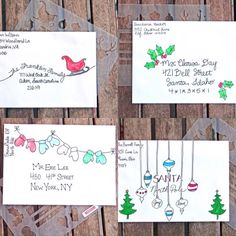 four christmas cards with handwritten names and ornaments hanging from hooks on a wooden fence