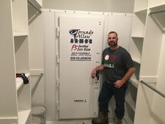 a man standing in front of a white locker with writing on the door and other items around him