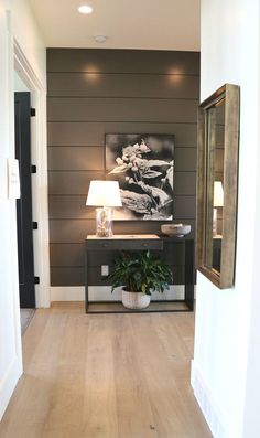 the hallway is clean and ready to be used as a living room or dining area