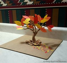 a tree made out of pieces of paper