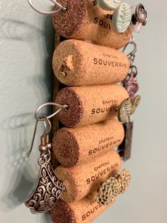 several corks are hanging on the wall