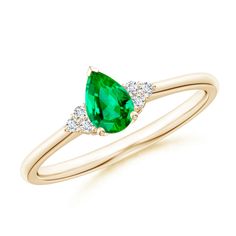 A rich green emerald is secured in a prong setting and flanked by sparkling diamond clusters. Designed in 14k yellow gold, this pear-shaped emerald ring looks breathtakingly elegant. Tsavorite Solitaire Ring, Emerald Solitaire Ring, Tsavorite Ring, Contemporary Ring, Sparkling Diamond, Diamond Solitaire Rings, Green Emerald, Diamond Cluster, Emerald Ring