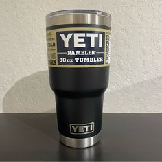 a yeti tumbler cup sitting on top of a table