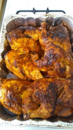 some chicken is sitting in a pan on the stove