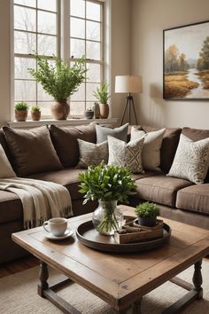 a living room filled with lots of furniture and plants on top of a coffee table