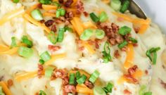 mashed potatoes with bacon, celery and green onions in a skillet