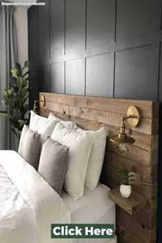 the headboard is made out of wood and has white sheets, pillows and blankets