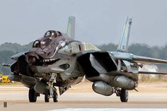 a fighter jet is on the runway ready to take off