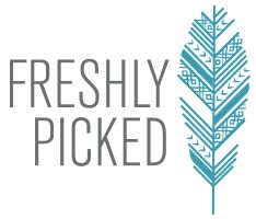 the freshly picked shop logo is shown on a white background with an arrow in gold