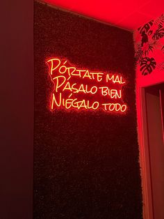 a neon sign on the side of a building that says portale mai paanoo ben neggalo too