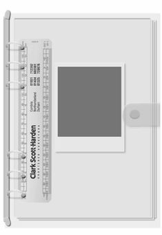 a white photo album with a ruler on it