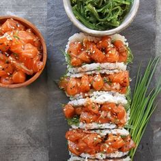 there are many different types of food on the table, including sushi and vegetables