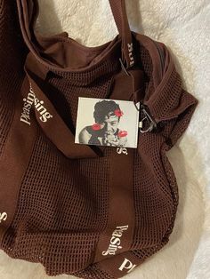 a brown purse with a sticker on it