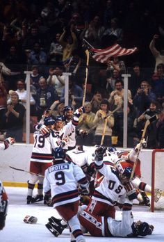 the hockey team is celebrating their victory over the crowd