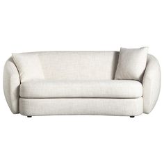 a white couch with two pillows on it