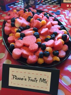 there is a plate full of fruit on the table