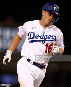 dodgers baseball player running with bat in hand