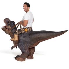 a man riding on the back of an inflatable dinosaur