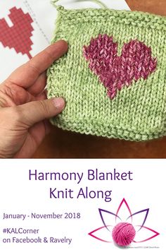 a hand holding up a knitted heart on top of a piece of paper with the words harmony blanket knit along