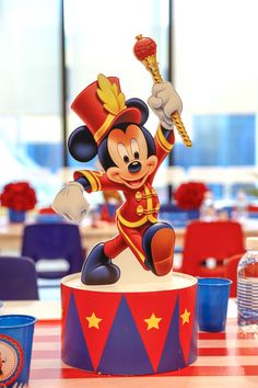 a mickey mouse figurine on top of a table