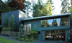 a large blue house with lots of windows