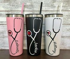 three different colored tumblers with stethoscopes on them