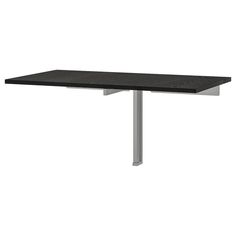 a black table sitting on top of a white floor