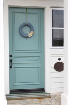 an image of a blue front door with the name alexandria gorgeous front door, color is shewn williams dixie