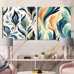 two paintings on the wall in a living room