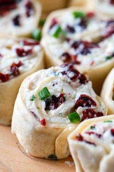 small rolls with cranberry filling on a cutting board, ready to be eaten