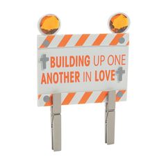 a sign that says building up one another in love