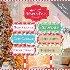 the north pole christmas labels are on display in front of a christmas tree