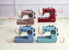 four different types of sewing machines sitting next to each other