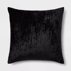 a black velvet pillow on a white background