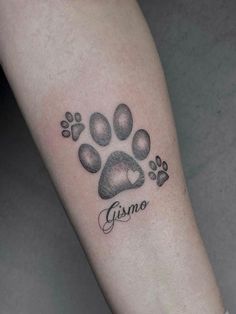 a dog paw with the word gismo written in cursive writing on it