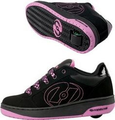 a pair of black and pink shoes with the letter d on it's sole