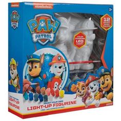 the paw patrol light up figure set is in its box and includes all kinds of toys