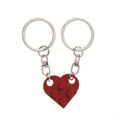 two red heart shaped lego key chains