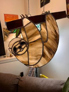 a stained glass hanging light in a living room