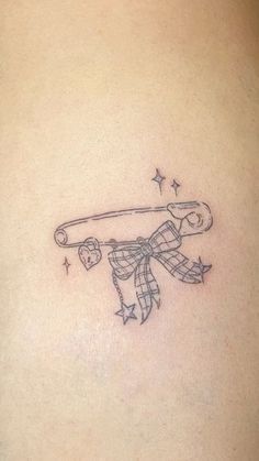 a person with a tattoo on their back holding a baseball bat and wearing a bow