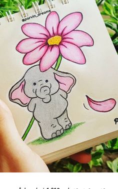 an elephant holding a pink flower on top of a notepad with the words happy mother's day written below it