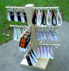 a rack with several pairs of scissors hanging from it