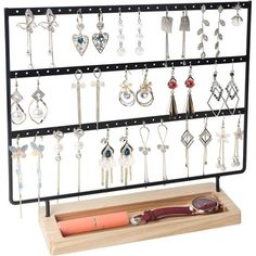 a jewelry rack with several pairs of earrings on it