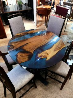 a table with chairs around it in a room