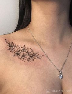 a woman with a flower tattoo on her chest