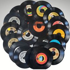 a pile of black and white records sitting on top of each other